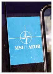 Il simbolo di MSU per AFOR insieme a quello NATO. Felice sintesi di una complessa missione.